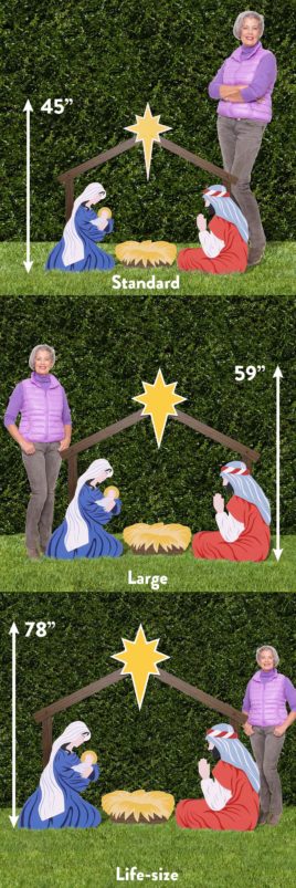 woman standing next to three nativity set sizes
