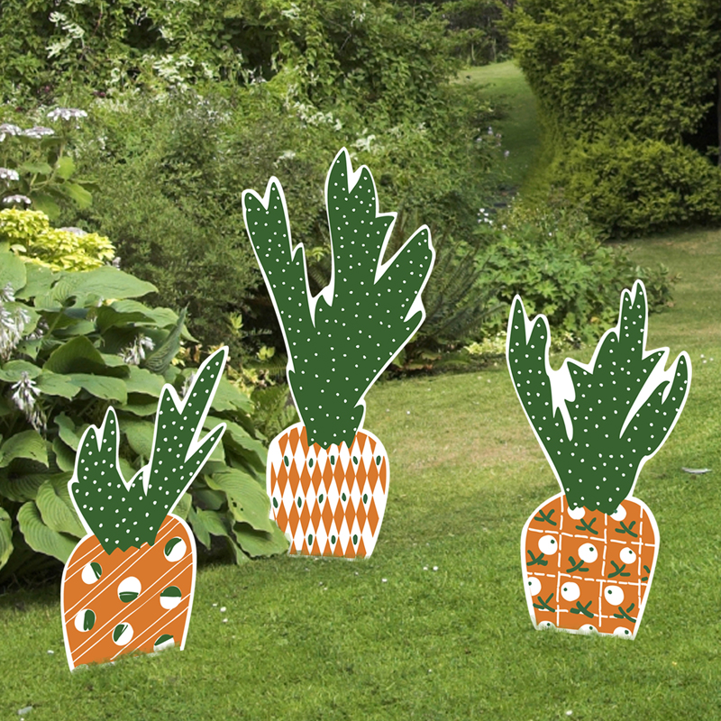 Plastic Easter carrot signs in garden