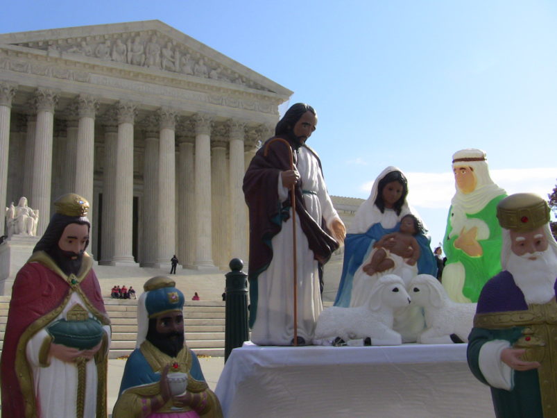 Lighted plastic outdoor nativity scenes in front of US Supreme Court building