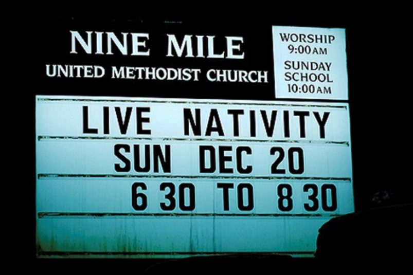 Church marquee advertising live nativity at Christmas