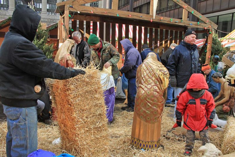 Members of Chicago group putting up nativity scene