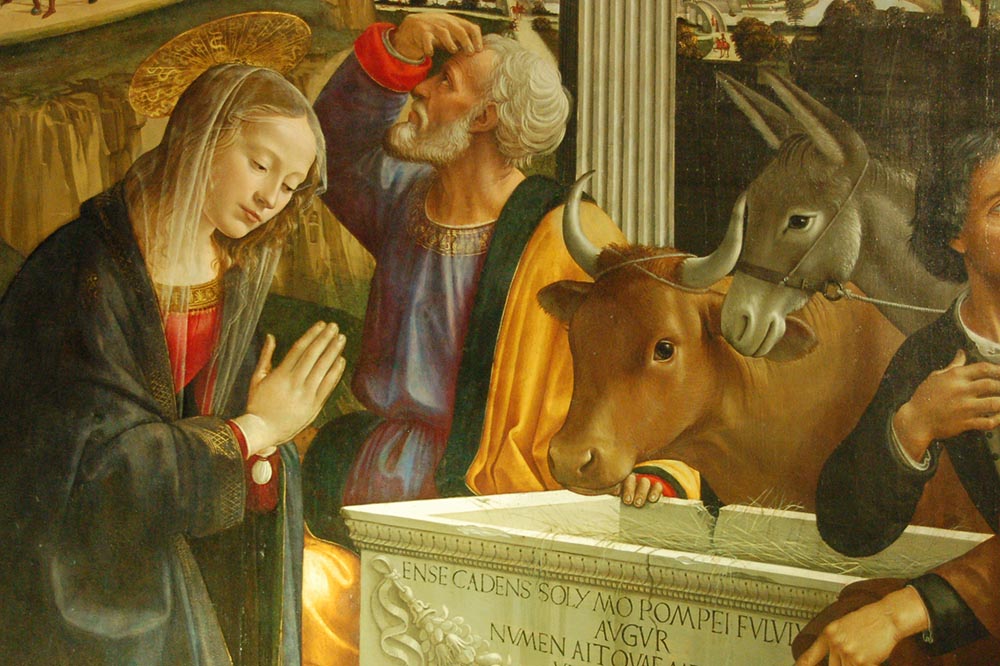 donkey and ox next to Virgin Mary at nativity